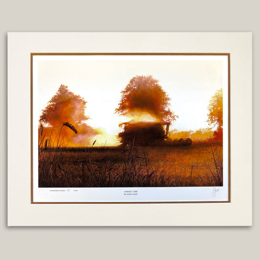 print of a combine harvester at sunset