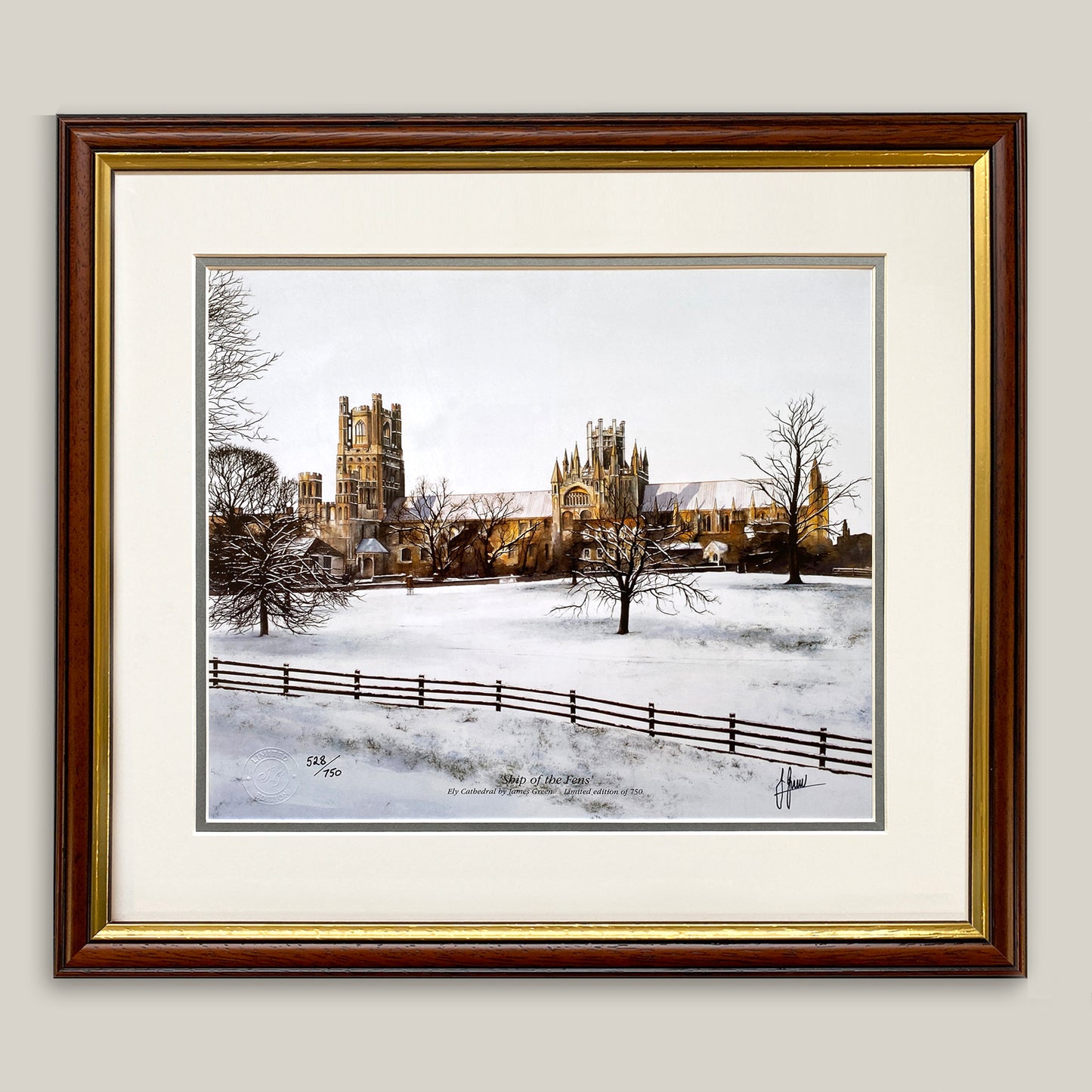painting of Ely Cathedral in the snow framed in a dark wood frame 