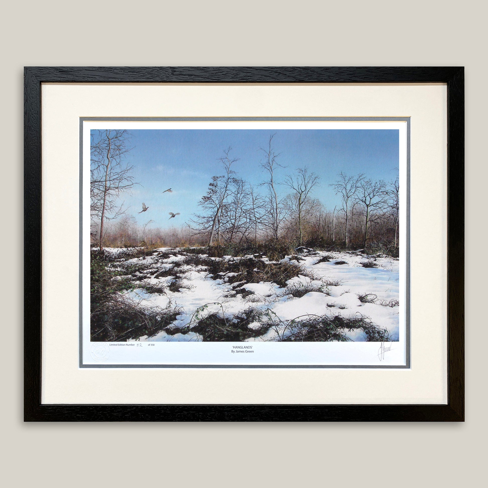 Painting of Pheasants flying in a snowy woodland, in a black frame