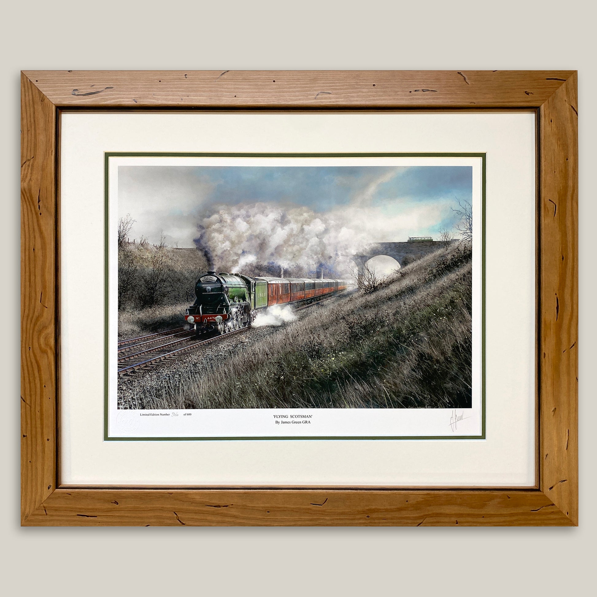 framed painting of the Flying Scotsman engine in apple green livery pulling a rake of teak coaches
